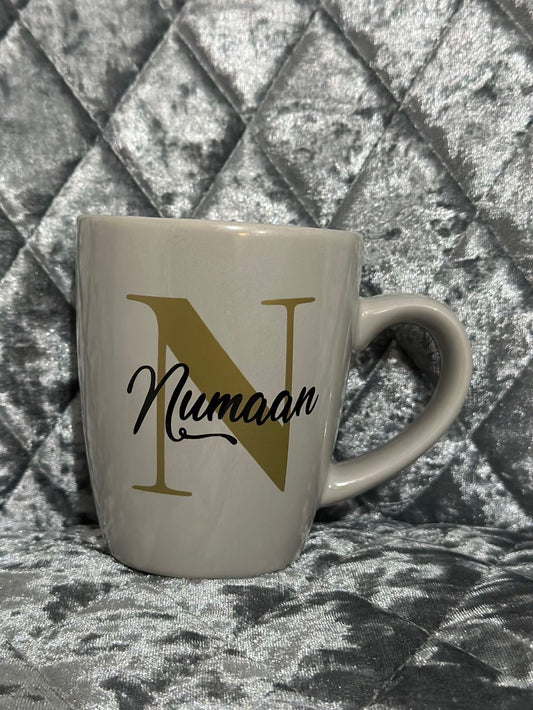 Personalised mug- Gold letter with name in a black colour.