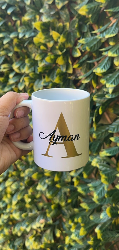 Personalised mug- Gold letter with name in a black colour.