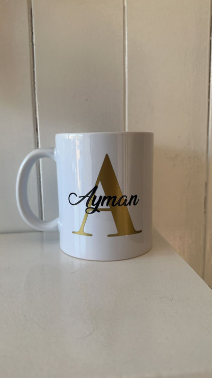 Personalised mug- Gold letter with name in a black colour.