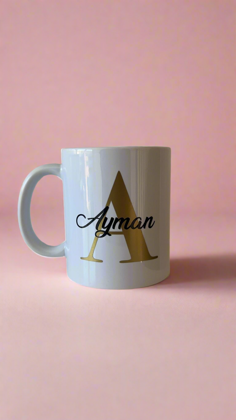 Personalised mug- Gold letter with name in a black colour.