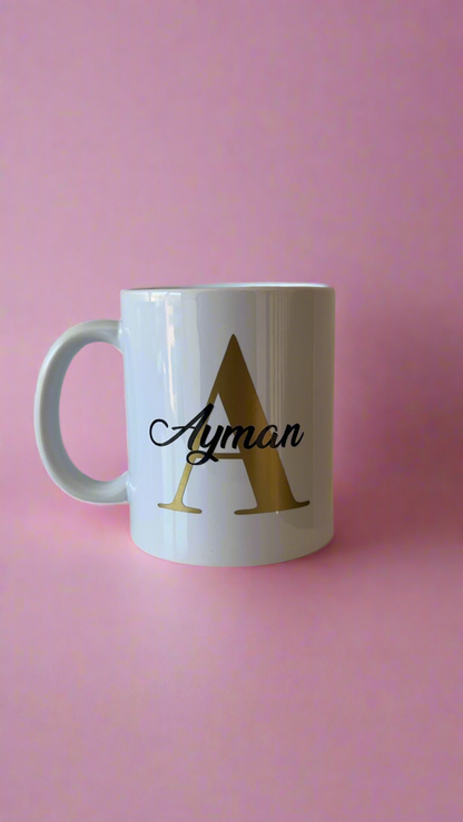 Personalised mug- Gold letter with name in a black colour.